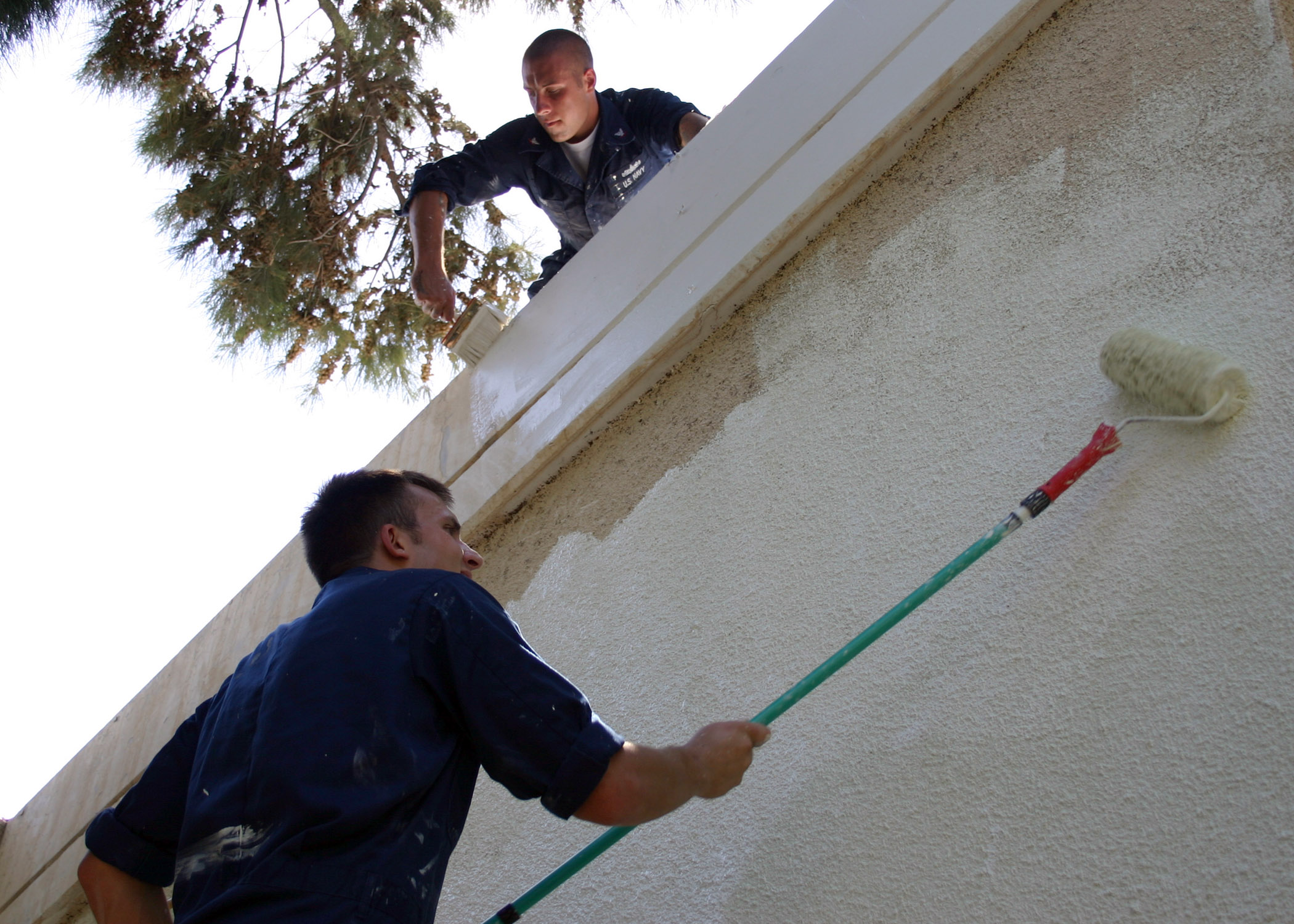 060904-N-3594V-001
Limassol, Cyprus (Sept. 4, 20060 - Interior Communications Electrician 3rd Class Steve Chisholm (bottom) and Electronics Technician 3rd Class Joshua Miller paint the exterior walls of the Theotokos Foundation in Limassol, Cyprus, as part of a community relations project. About 50 service members and civilian mariners from USS Mount Whitney (LCC/JCC 20) and the embarked Joint Task Force (JTF) Lebanon staff participated in the painting of the residence. JTF Lebanon is responsible for the U.S. military aspects of the joint interagency efforts of the Department of State and the Department of Defense, which have resulted in the assisted departure of almost 15,000 American citizens from Lebanon and the distribution of millions of dollars in aid to the Lebanese people. U.S. Navy photo by Gunner's Mate 2nd Class Elizabeth Vlahos (RELEASED)